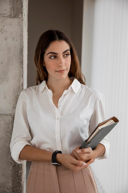 Front view of elegant businesswoman with agenda