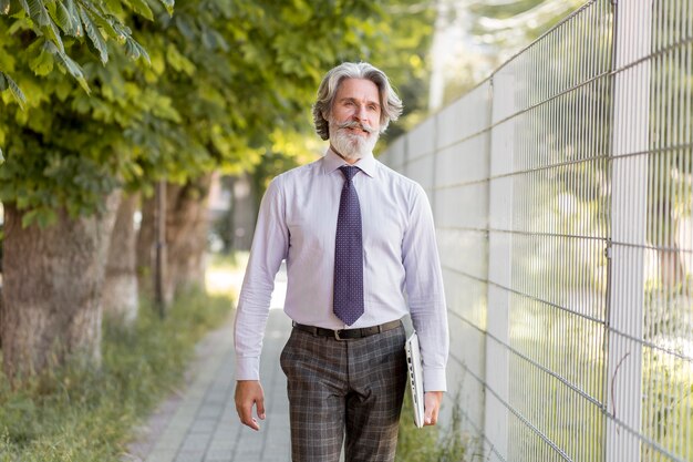 Front view elegant mature male walking