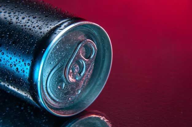 Front view energy drink in can on dark pink background color water soda darkness drink