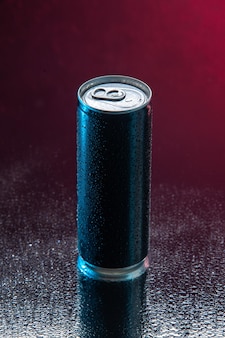 Front view energy drink in can on dark pink background drink color soda darkness