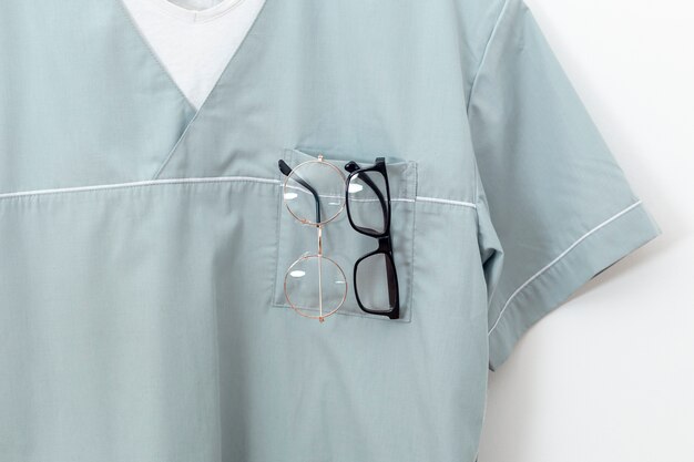 Front view of eye specialist outfit with pairs of glasses