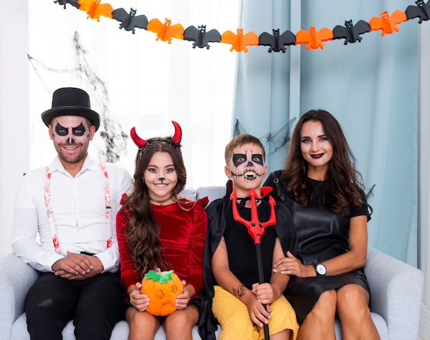 Front view family posing for halloween