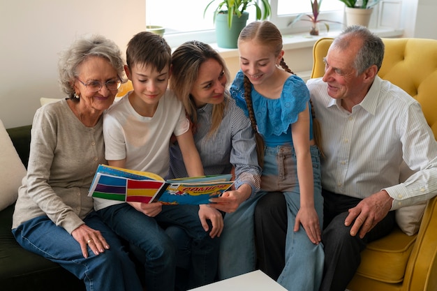 Front view family reading comics together