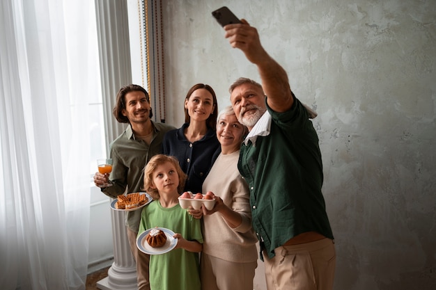 Free photo front view family taking selfie