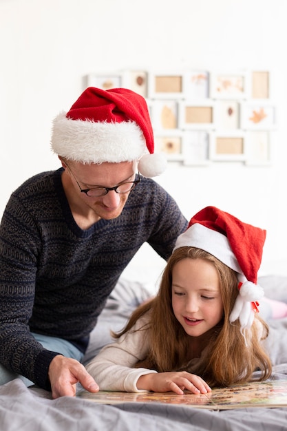 Front view of father and daughter with christmas