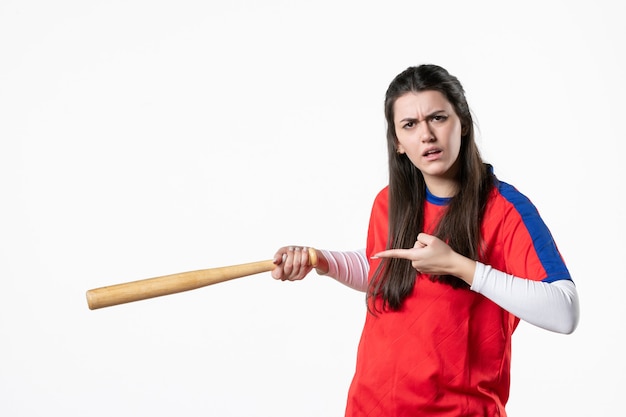 Front view female baseball player with bat and ball