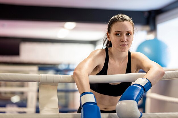 Front view female boxer in the ring