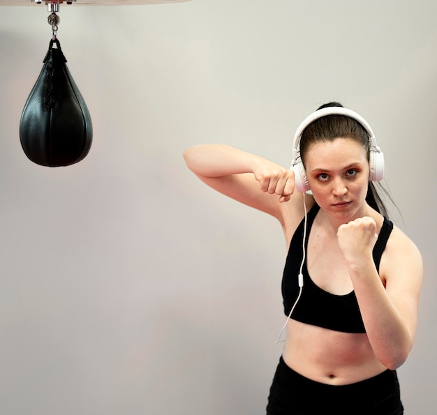 Front view of female boxer with headphones