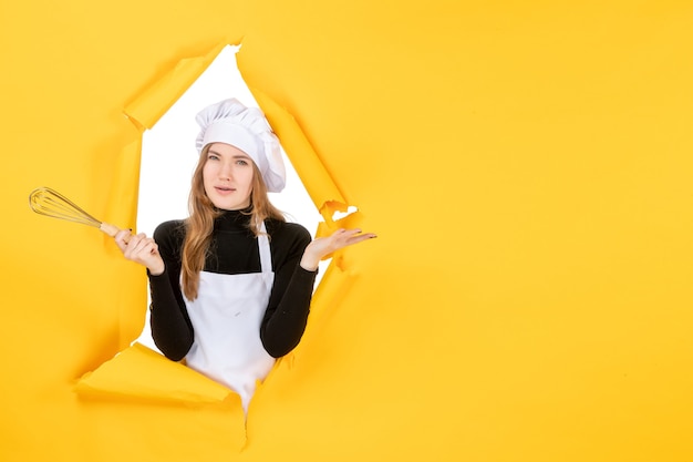 Free photo front view female cook in white cook cap on yellow job emotion food cuisine kitchen photo sun