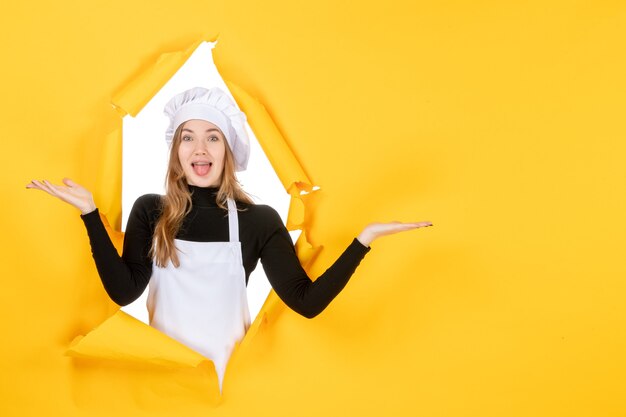 Front view female cook on yellow floor photo sun kitchen job color cuisine food paper