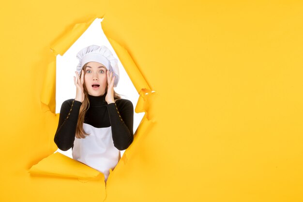 Front view female cook on yellow food sun cuisine photo paper job