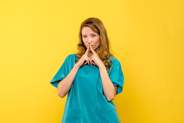 Front view female doctor curious on yellow space