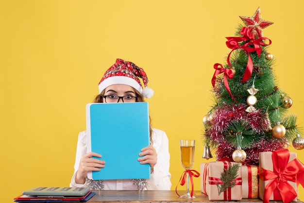 Front view female doctor holding different files