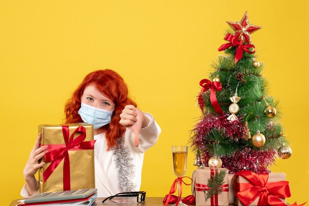 Front view female doctor holding present