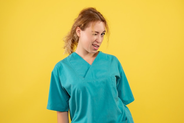 Front view female doctor in medical shirt, color covid-19 nurse health medic