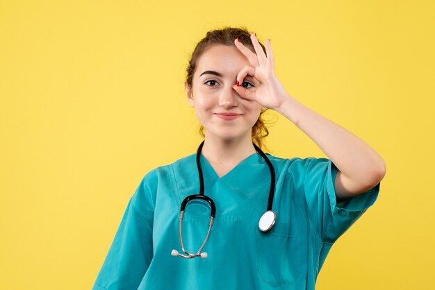 Front view female doctor in medical shirt, color emotion virus covid-19 uniform health