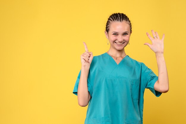 Front view female doctor in medical shirt, color hospital nurse covid-19 health virus