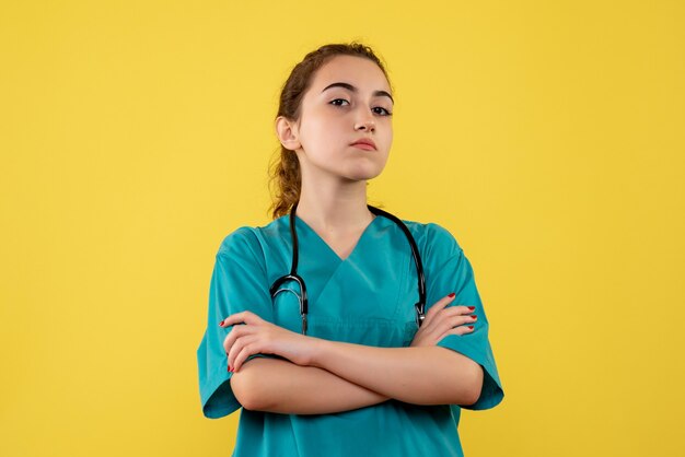 Front view female doctor in medical shirt, color virus covid-19 uniform health emotion