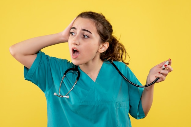 Front view female doctor in medical shirt, emotion virus covid-19 uniform health