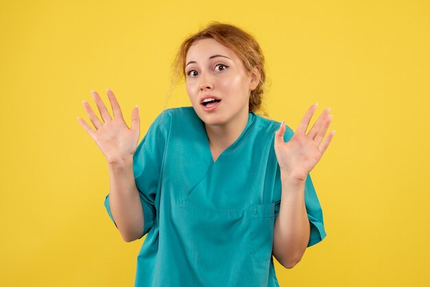 Front view female doctor in medical shirt, health color medic covid nurse