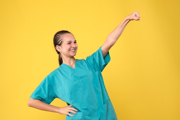 Front view female doctor in medical shirt, health medic emotion covid nurse hospital color