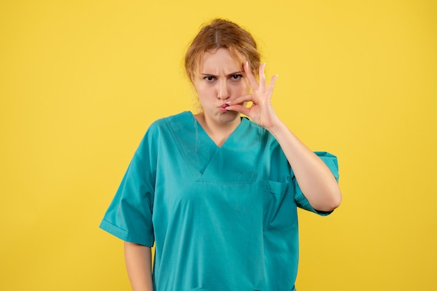 Front view female doctor in medical shirt, hospital medic covid-19 nurse color health medicine