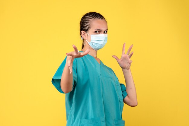 Front view female doctor in medical shirt and mask, health nurse hospital virus covid-