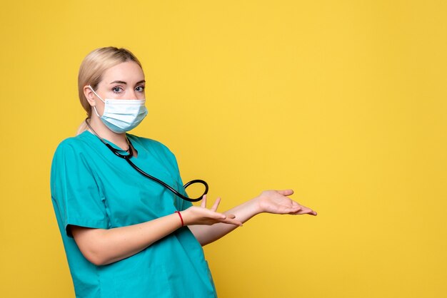 Front view female doctor in medical shirt and mask, hospital nurse covid-19 pandemic medic