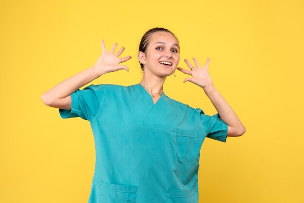 Front view female doctor in medical shirt, medic covid nurse hospital color emotion