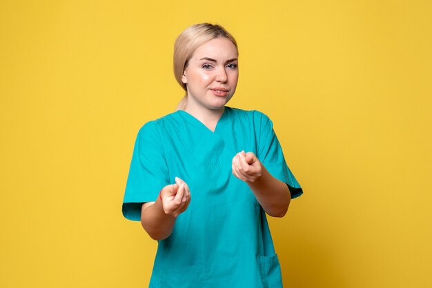 Front view female doctor in medical shirt, medic emotion covid-19 nurse