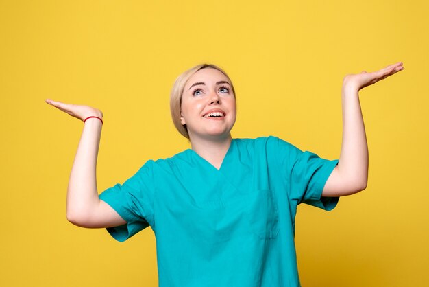 Front view female doctor in medical shirt, medic emotion pandemic covid nurse