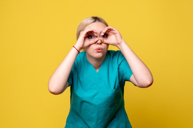 Front view female doctor in medical shirt, medic hospital covid-19 nurse emotion pandemic