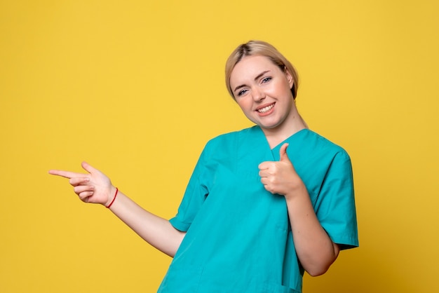 Front view female doctor in medical shirt, medic pandemic covid nurse emotion