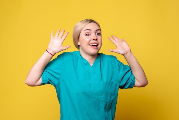 Front view female doctor in medical shirt, nurse medic covid-19 emotions pandemic