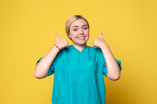 Front view female doctor in medical shirt, nurse medic covid emotion pandemic