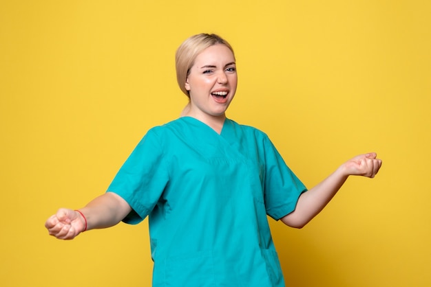 Front view female doctor in medical shirt, nurse medic hospital covid-19 emotion