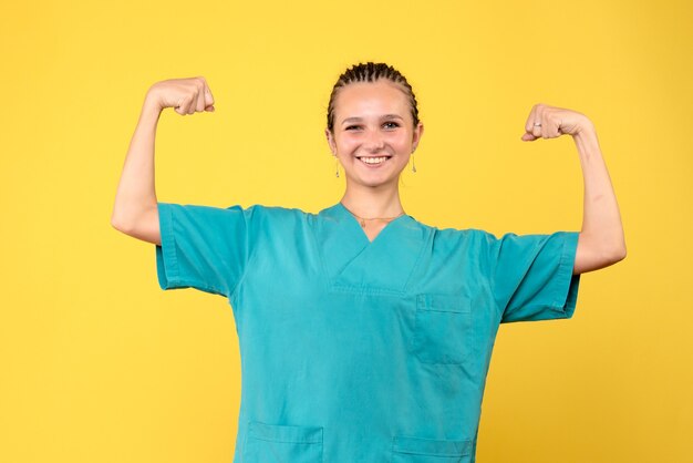 Front view female doctor in medical shirt, nurse virus covid-19 color hospital