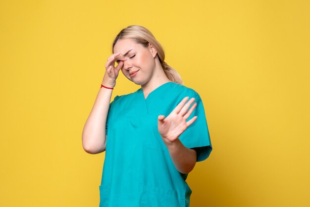 Front view female doctor in medical shirt, pandemic covid nurse medic