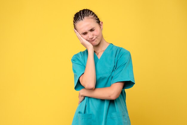 Front view female doctor in medical shirt stressed, health emotion nurse covid-19 virus color hospital