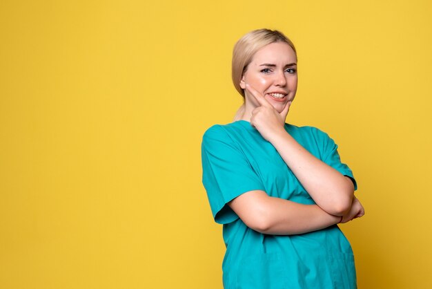 Front view female doctor in medical shirt thinking, medic hospital covid-19 pandemic emotion