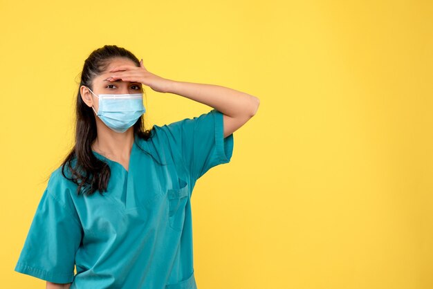 Front view female doctor putting hand