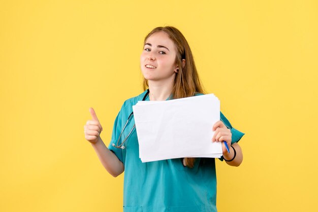 Front view of female doctor with documentation