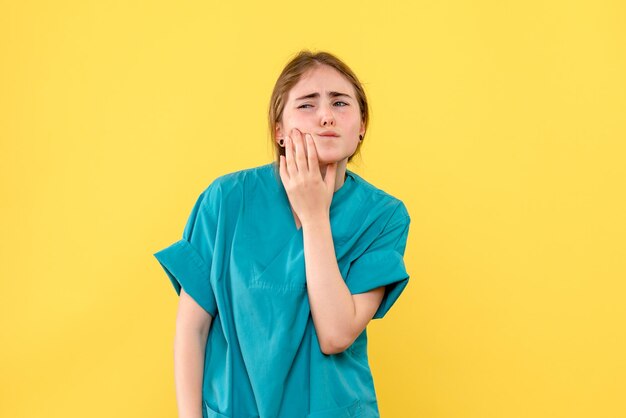 Front view of female doctor with hurt tooth