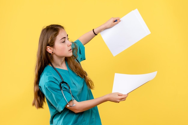 Front view of female doctor with papers