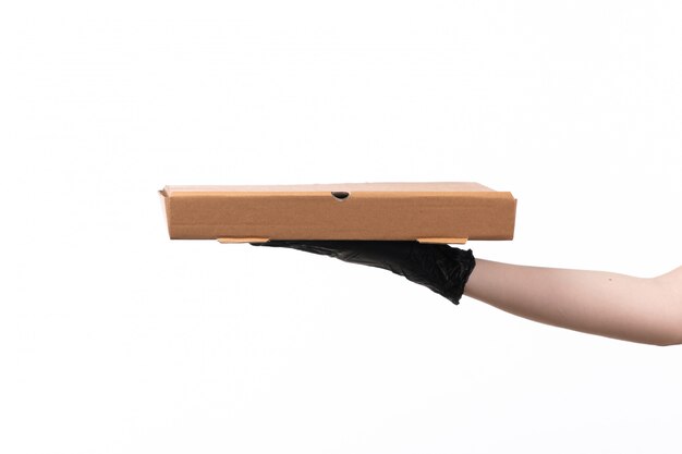 A front view female hand holding delivery box on white