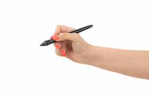 Free photo a front view female hand with colored nails holding pen on the white