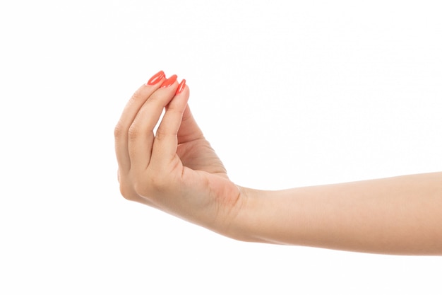 A front view female hand with colored nails tasty sign on the white