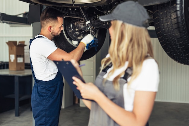 Front view female and man at service working