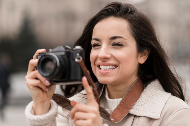 Front view of female photographer taking a picture