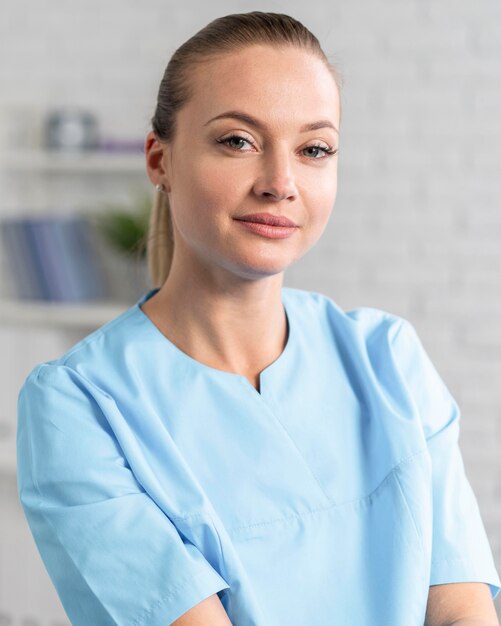 Front view of female physiotherapist posing